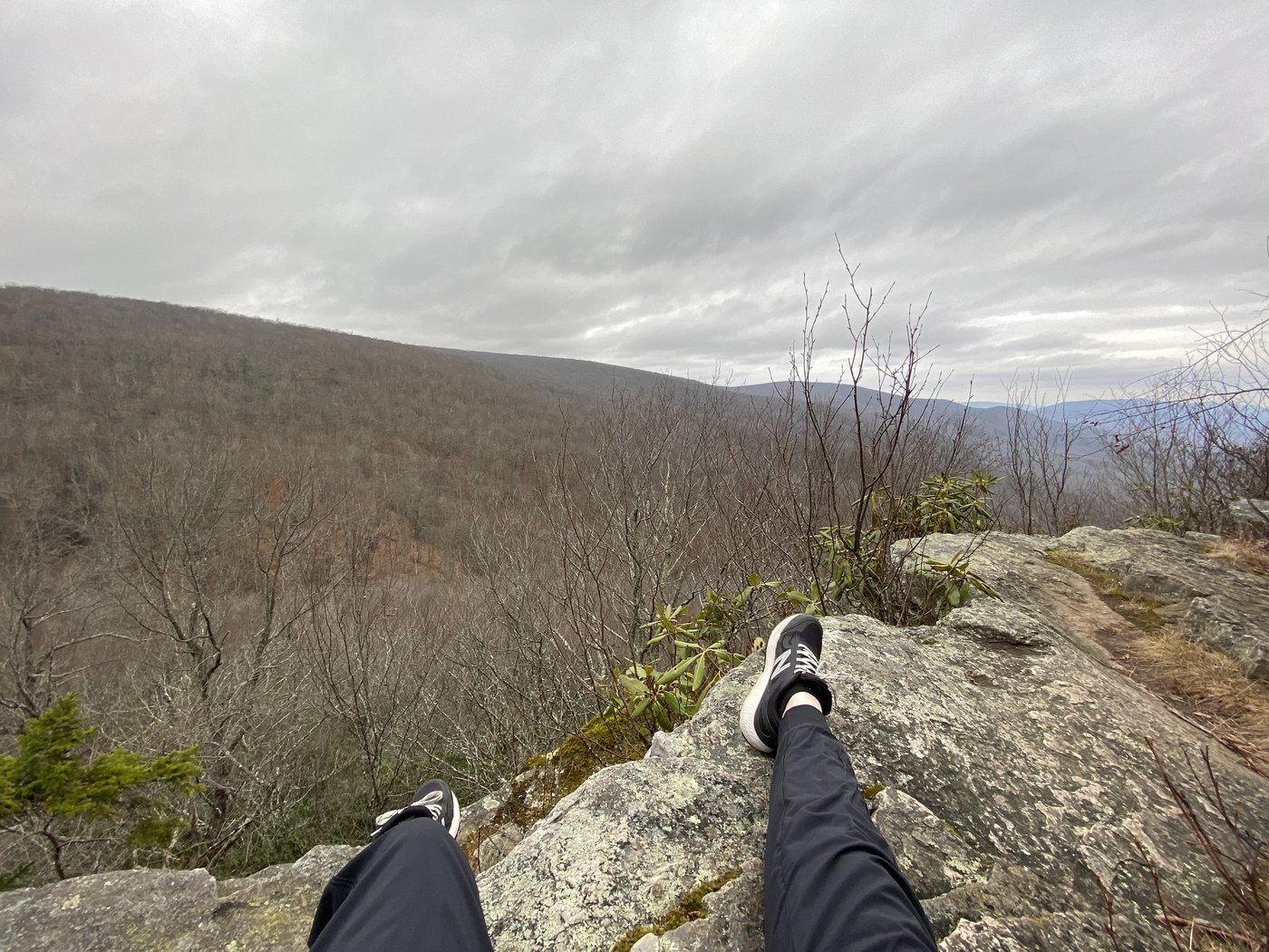 A resting spot on bare winter rock with an open ridge beyond