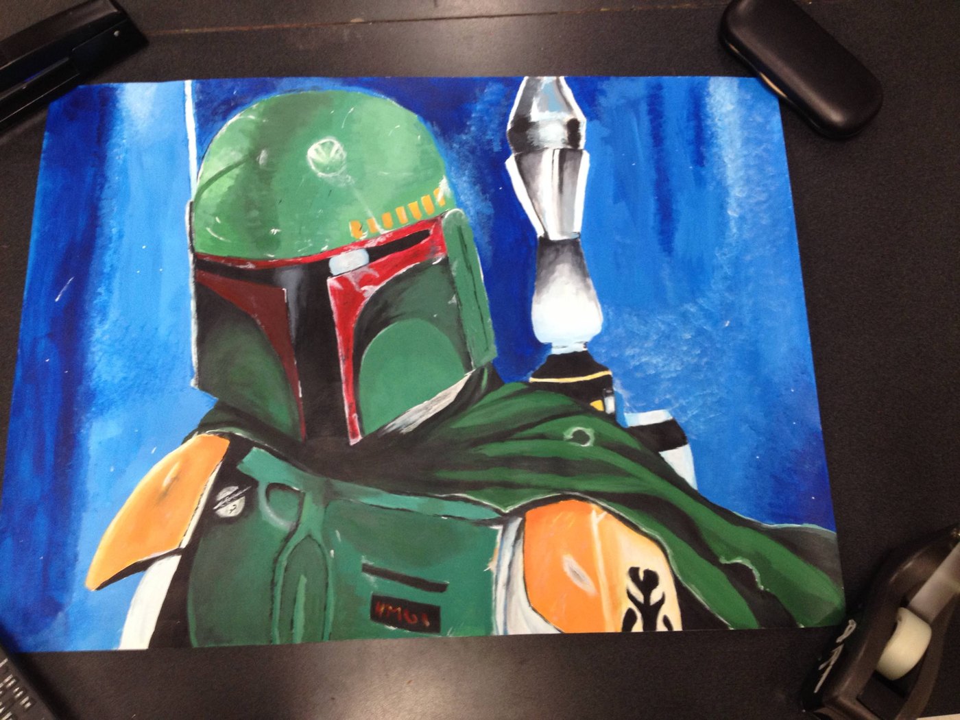 Painting of a green and orange Mandalorian-style helmet against a blue background