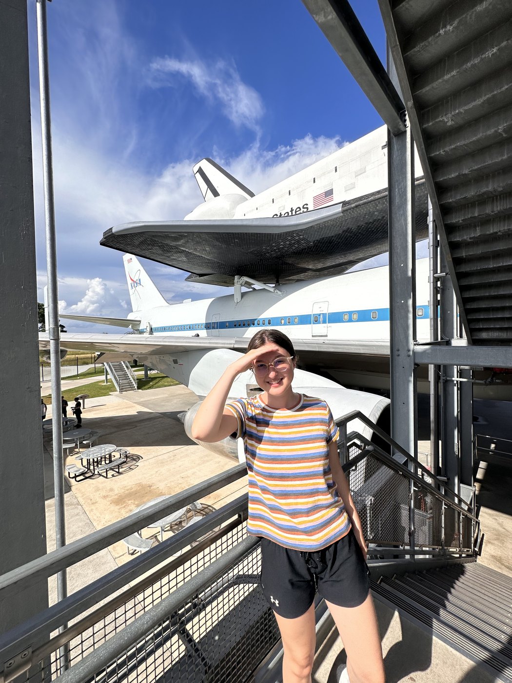 Madeline on a walkway beside the Space Shuttle Independence mounted on its Boeing 747 carrier aircraft