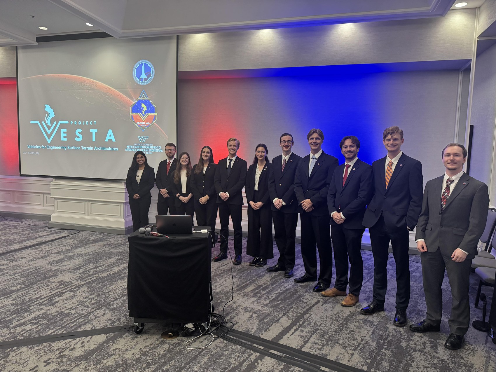 The 13-person VESTA team on stage at the RASC-AL Competition Forum